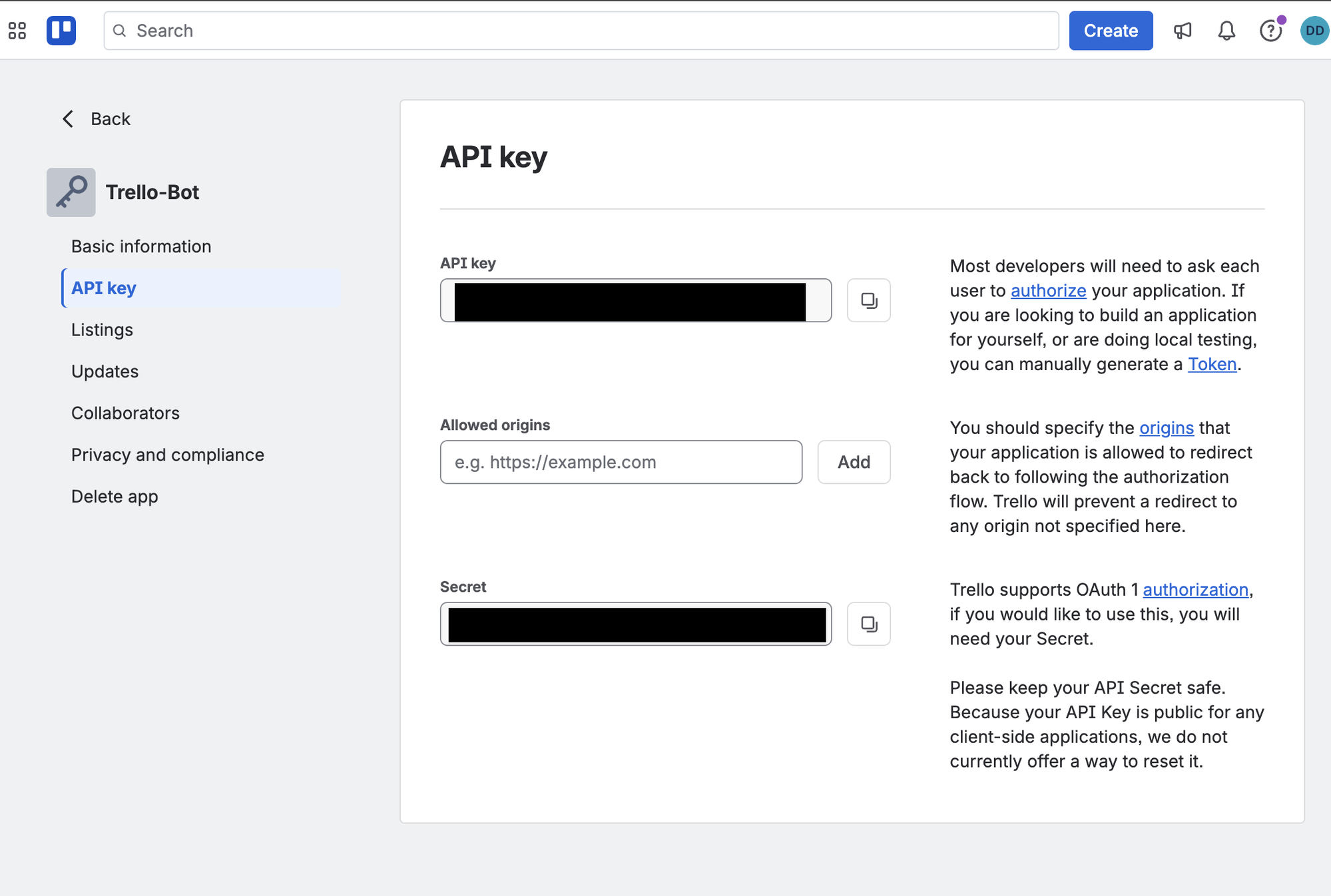 Trello Power-Up admin page on the "API key" tab. The API key and Secret fields are visible (redacted), and the right-hand description contains the blue "Token" link you click in the next step to generate your token.